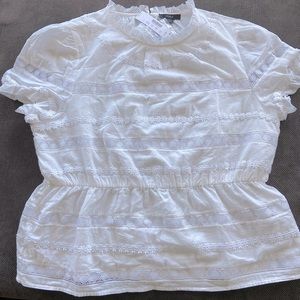 White embroidered peplum blouse